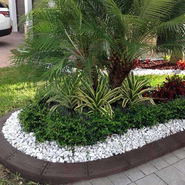 pebbles border around plants 