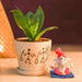 sansevieria plant in decorative ceramic pot with lord ganesha idol 