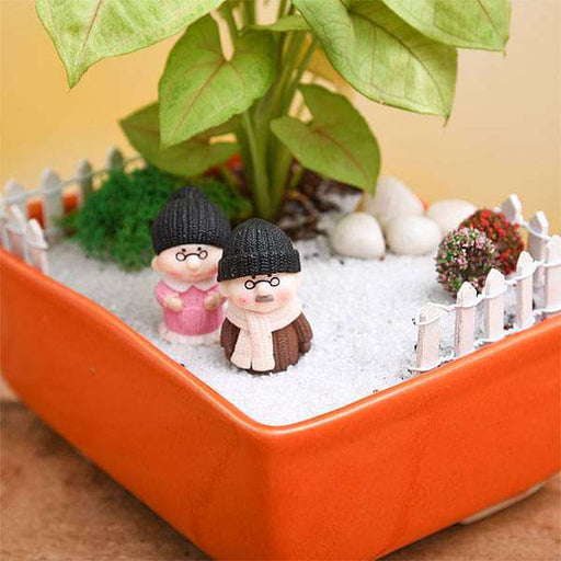 diy dada dadi enjoying snowfall in garden - miniature garden